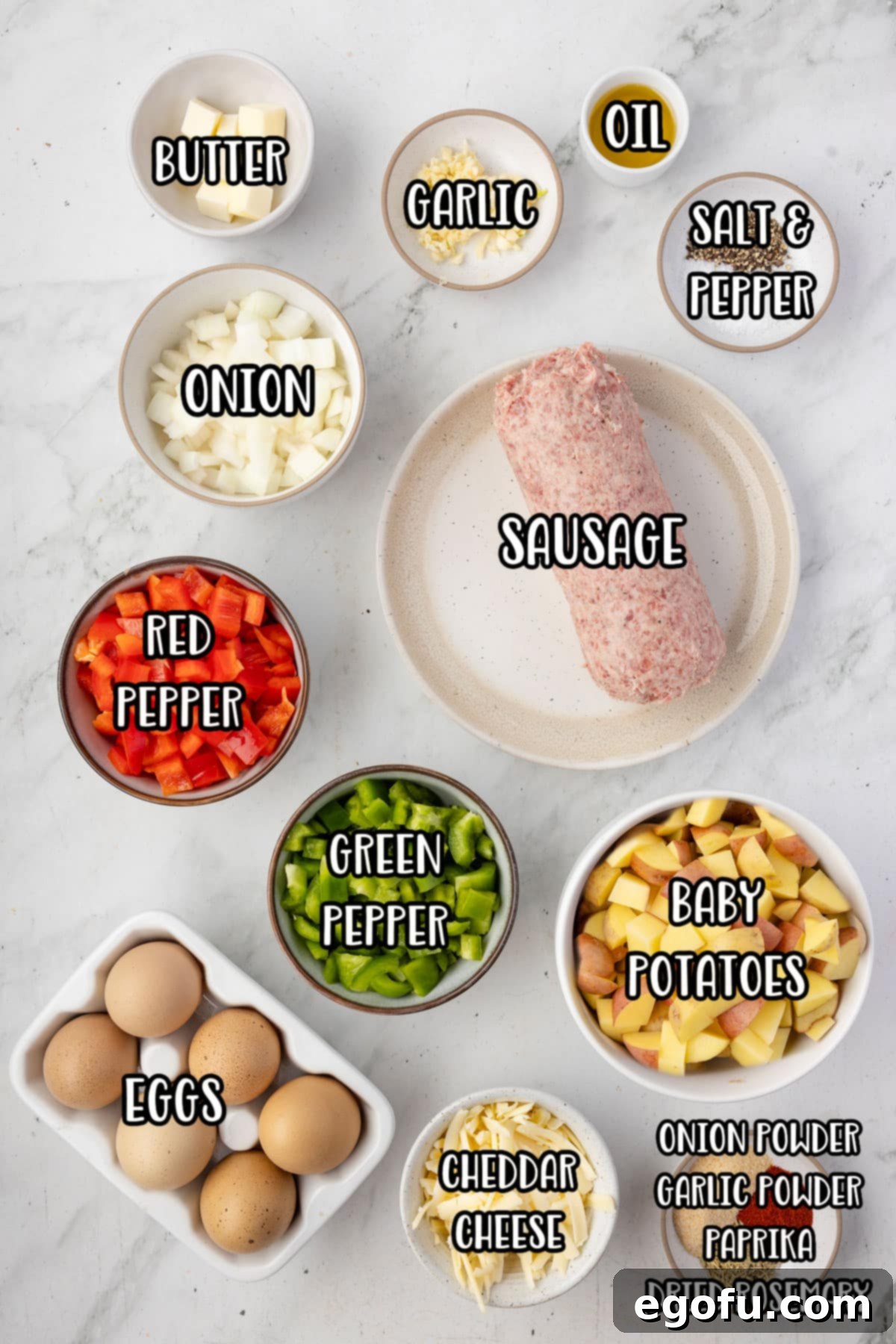 Ground sausage, olive oil, baby potatoes, red pepper, green pepper, yellow onion, garlic cloves, dried rosemary, onion powder, garlic powder, paprika, salt, pepper, salted butter, eggs, and shredded cheese.