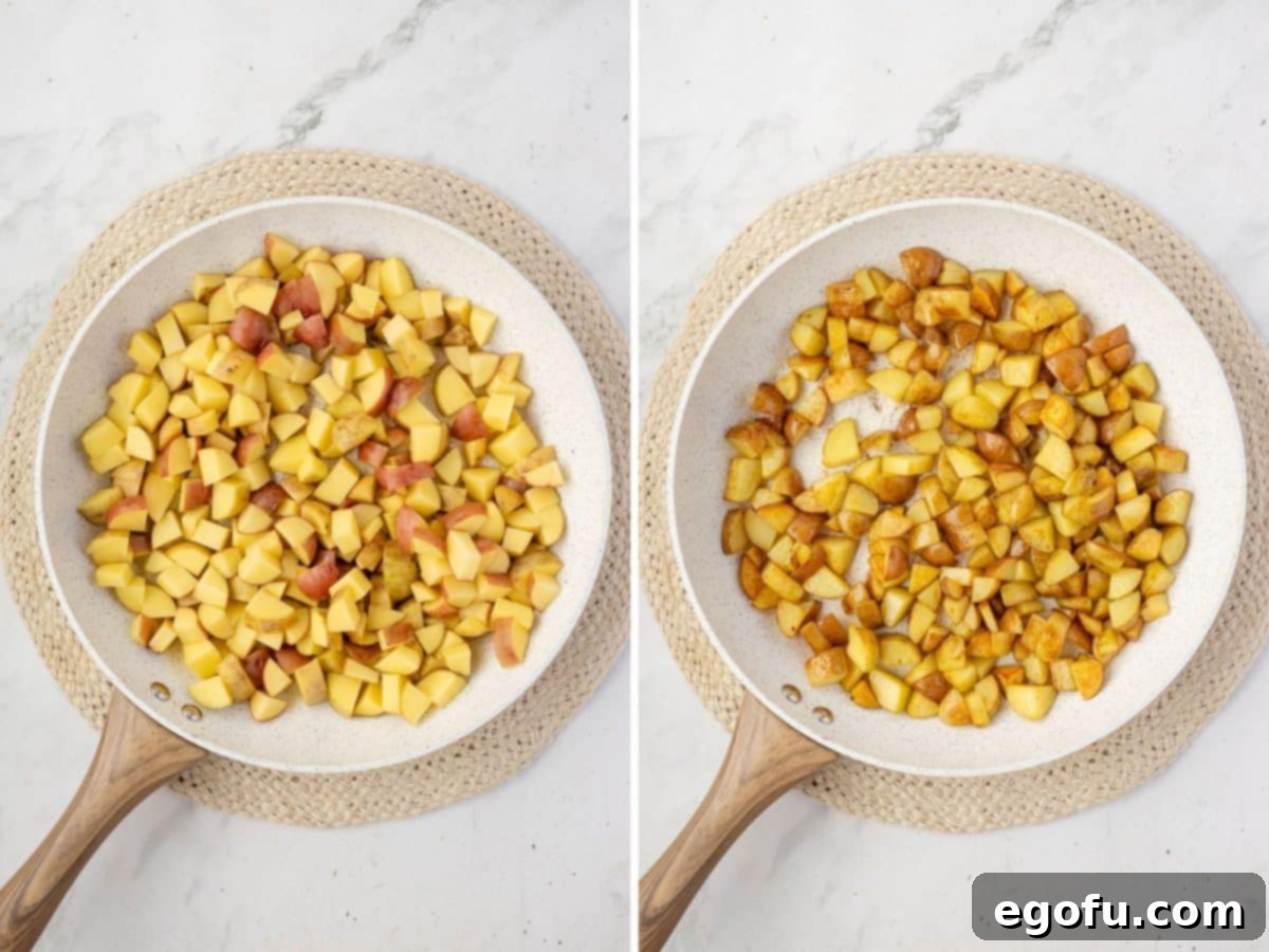 Potatoes being cooked in a skillet.