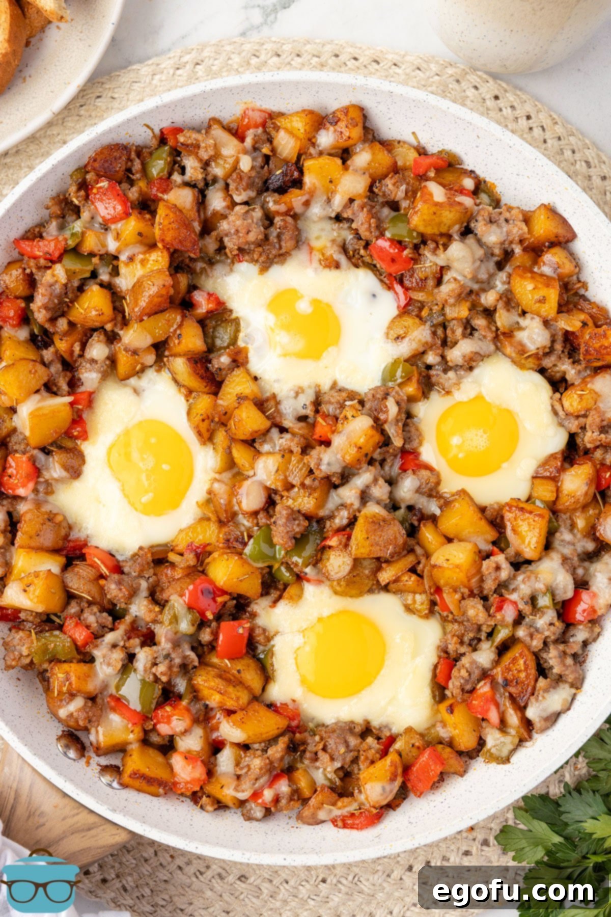 Looking down on a skillet of Breakfast Hash with eggs.
