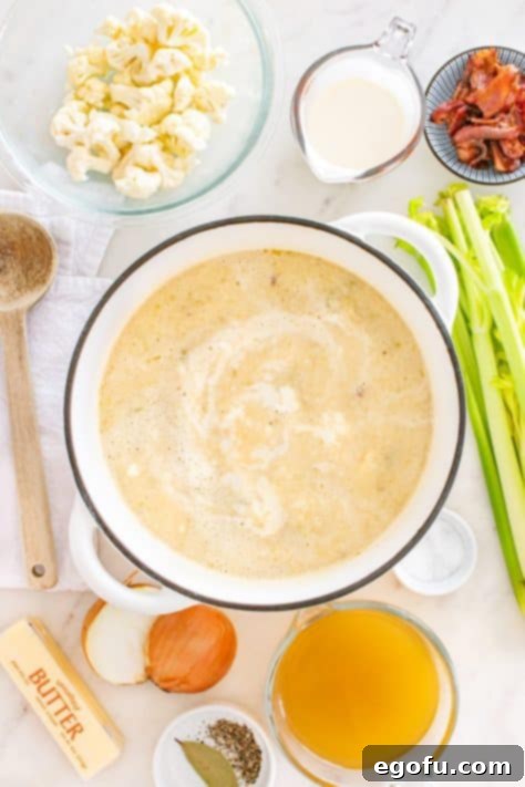 Cornstarch slurry being slowly added to a simmering pot of soup to thicken it.