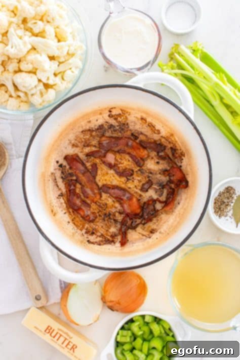 Bacon cooking in a pot.