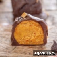 Close up looking at a Pumpkin Truffle that was bit in half.