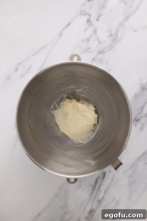 Powdered sugar and cream cheese mixture in a bowl.