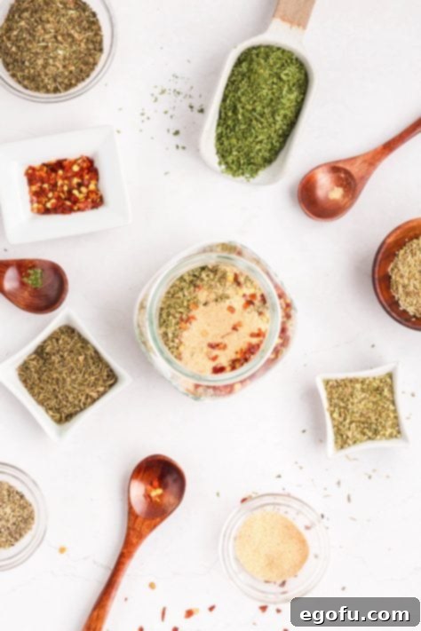 A mix of seasonings to make Homemade Italian Seasoning in a jar.