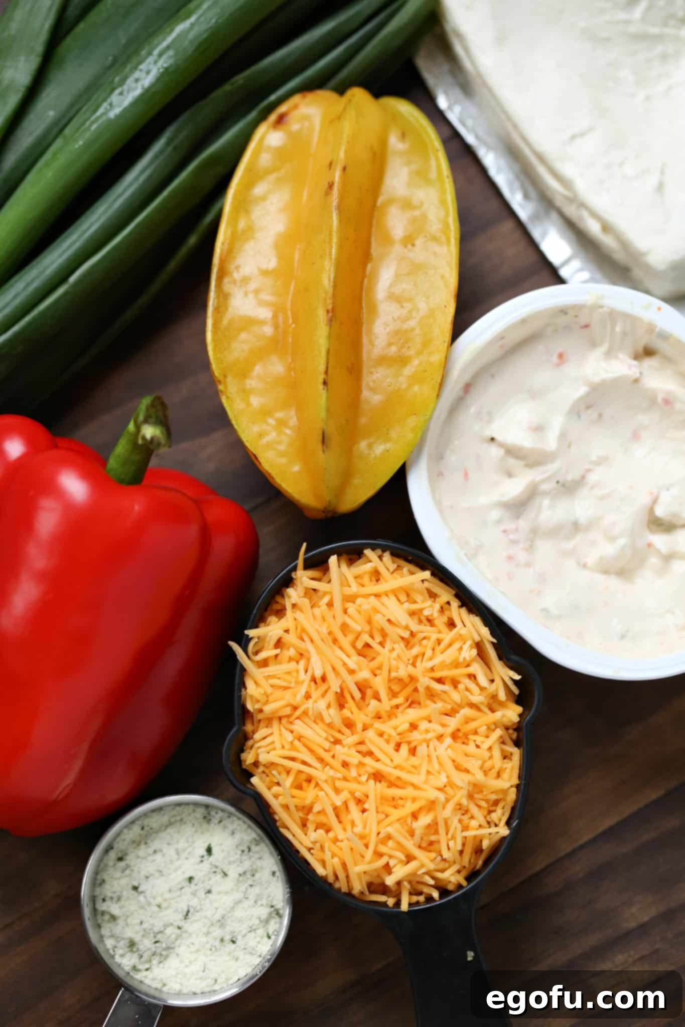 star fruit, cream cheese, shredded cheese, red pepper, ranch dressing and green onions.