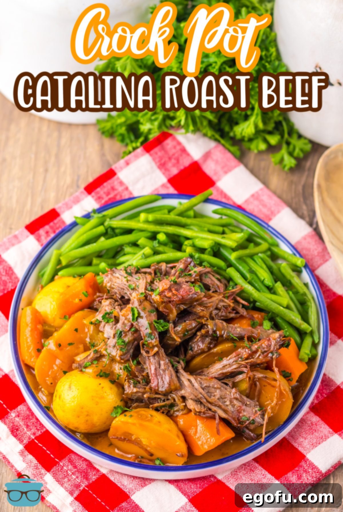 A plate of green beans with Crock Pot Catalina Roast Beef and vegetables.