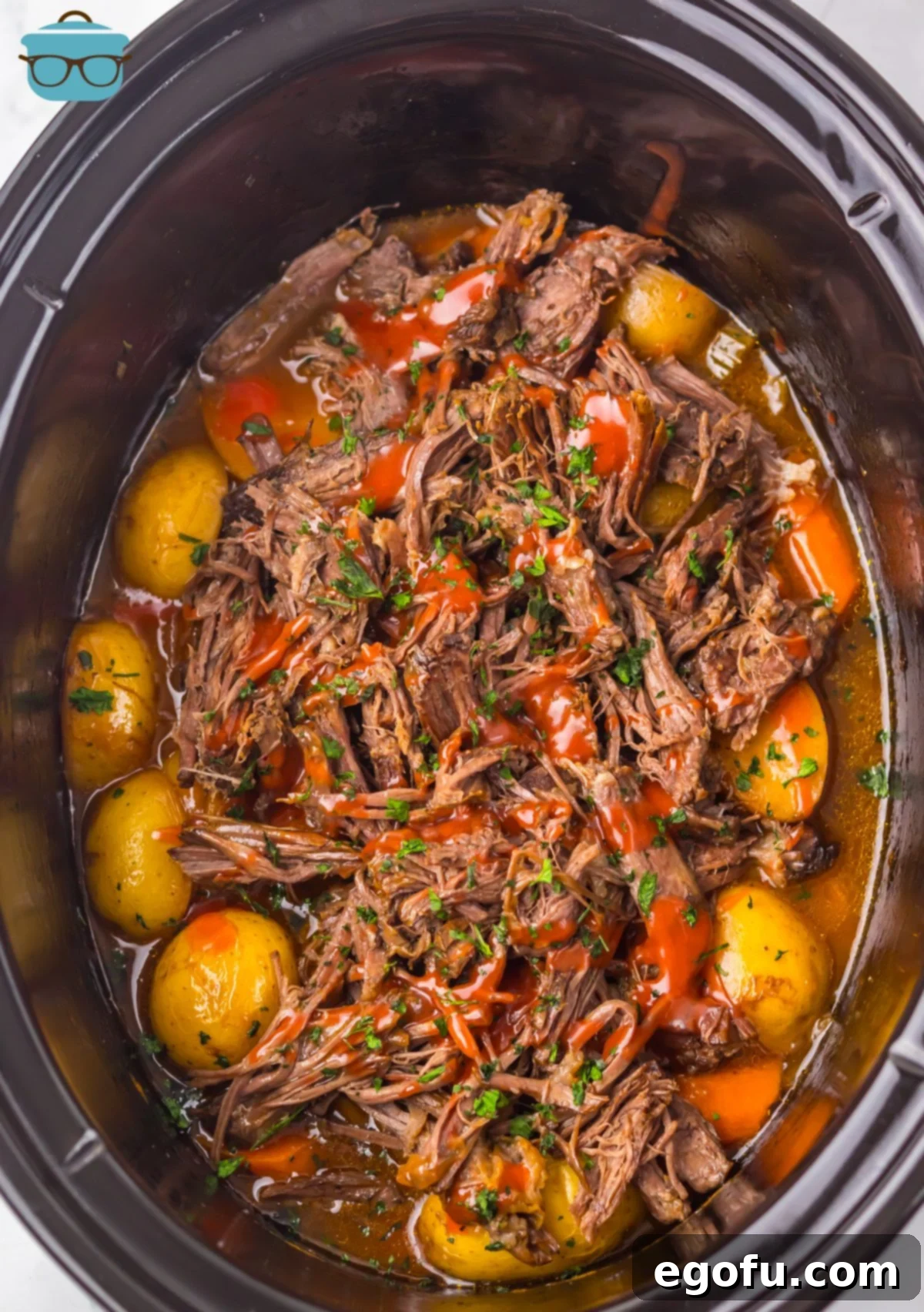 Looking down in a Crock Pot of Catalina Roast Beef and vegetables.