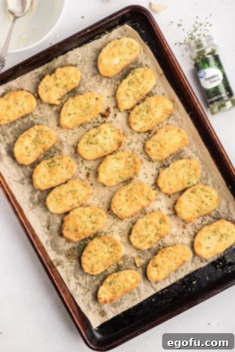 Baked Party Puffs on a lined baking sheet.