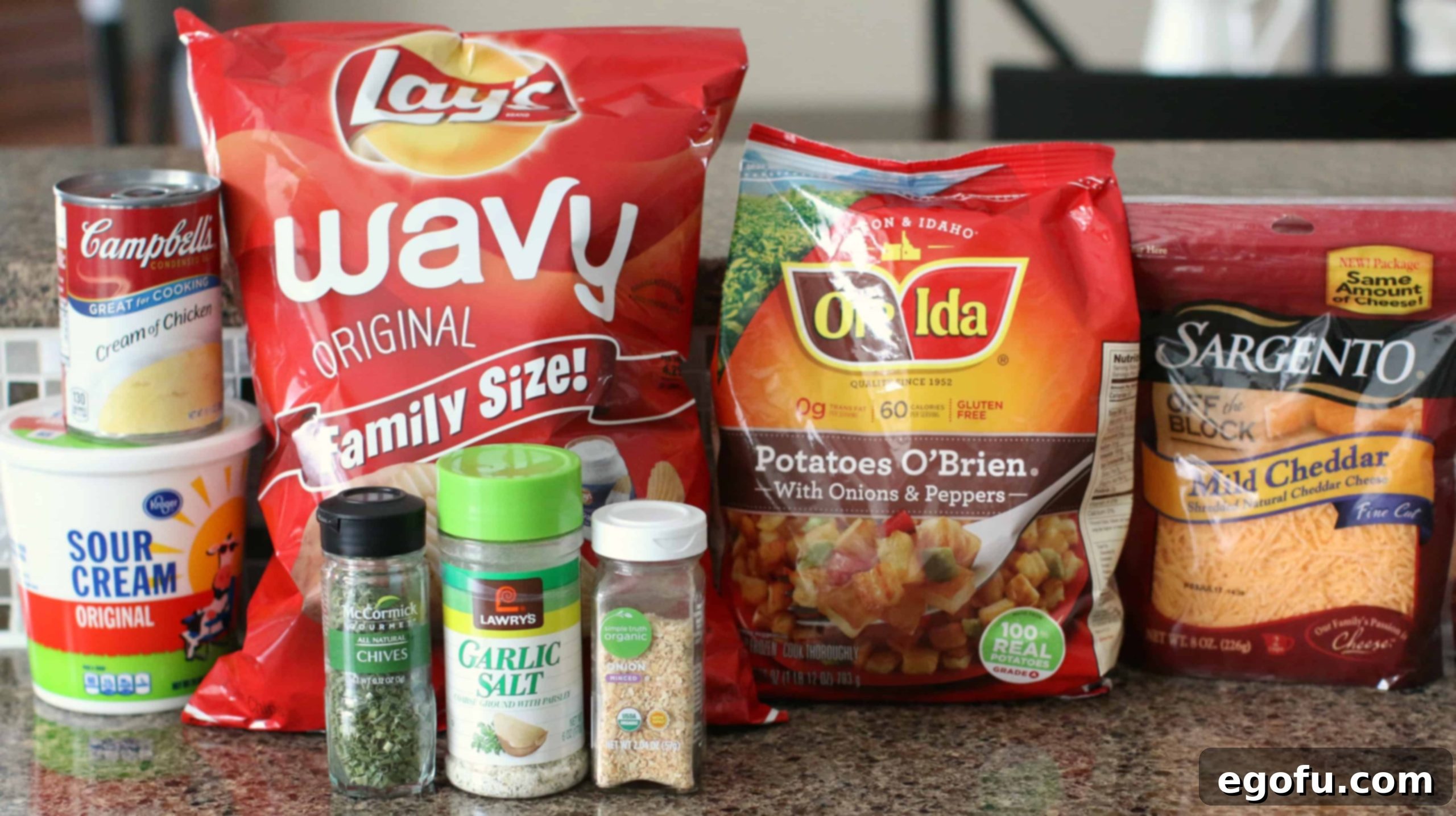 A collage of ingredients for Funeral Potatoes, including O'Brien potatoes, potato chips, sour cream, cream of chicken soup, shredded cheddar cheese, chives, garlic salt, and onion flakes.
