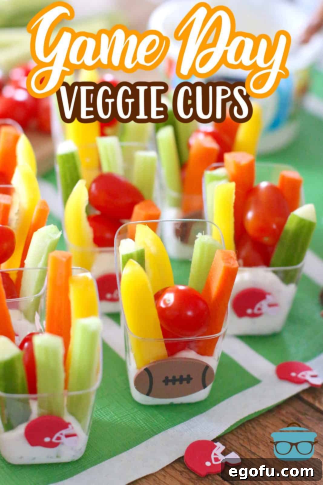 Clear individual cups filled with slices of colorful fresh vegetables, dipped in creamy ranch dressing.