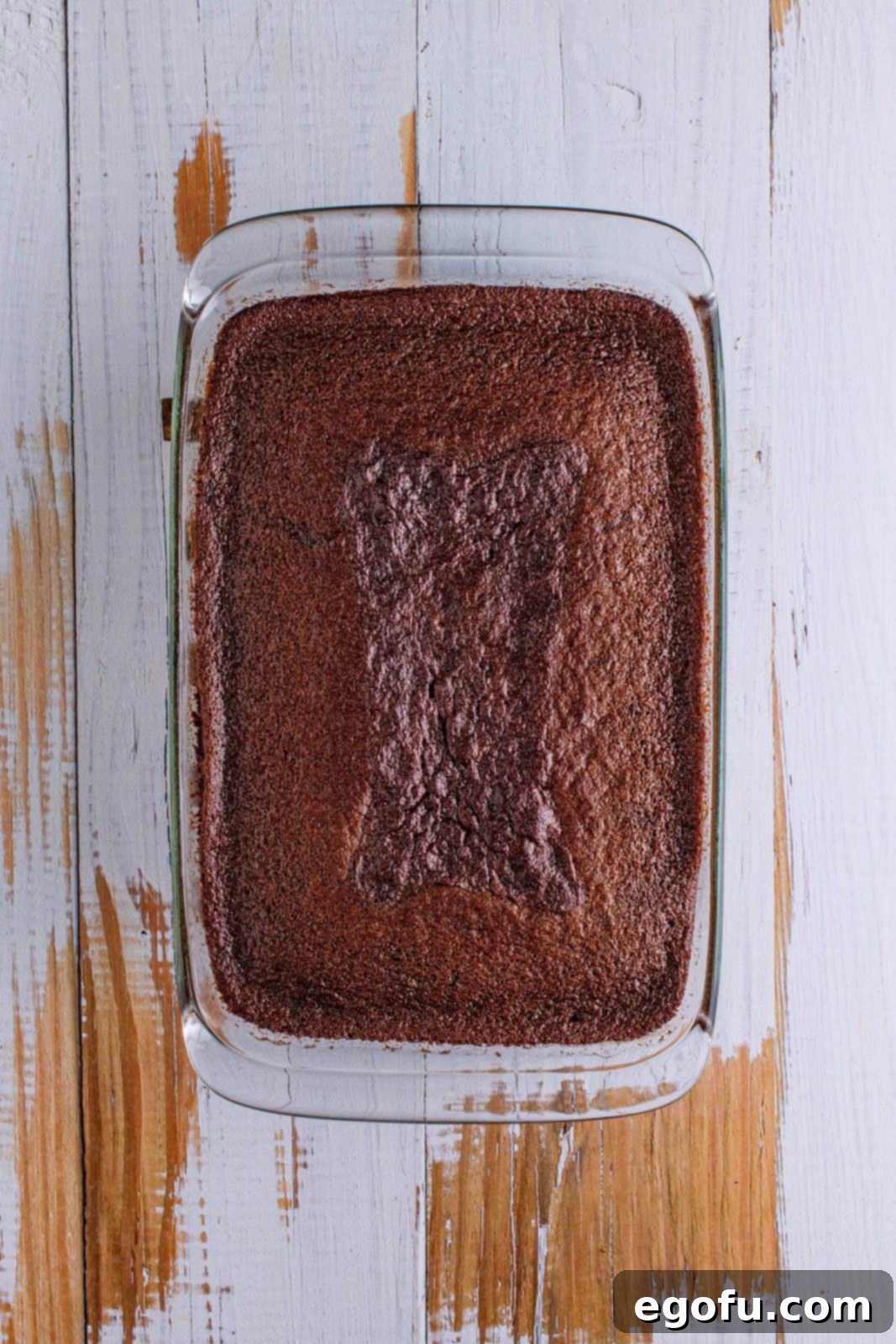 fully baked chocolate cake in a clear baking dish.