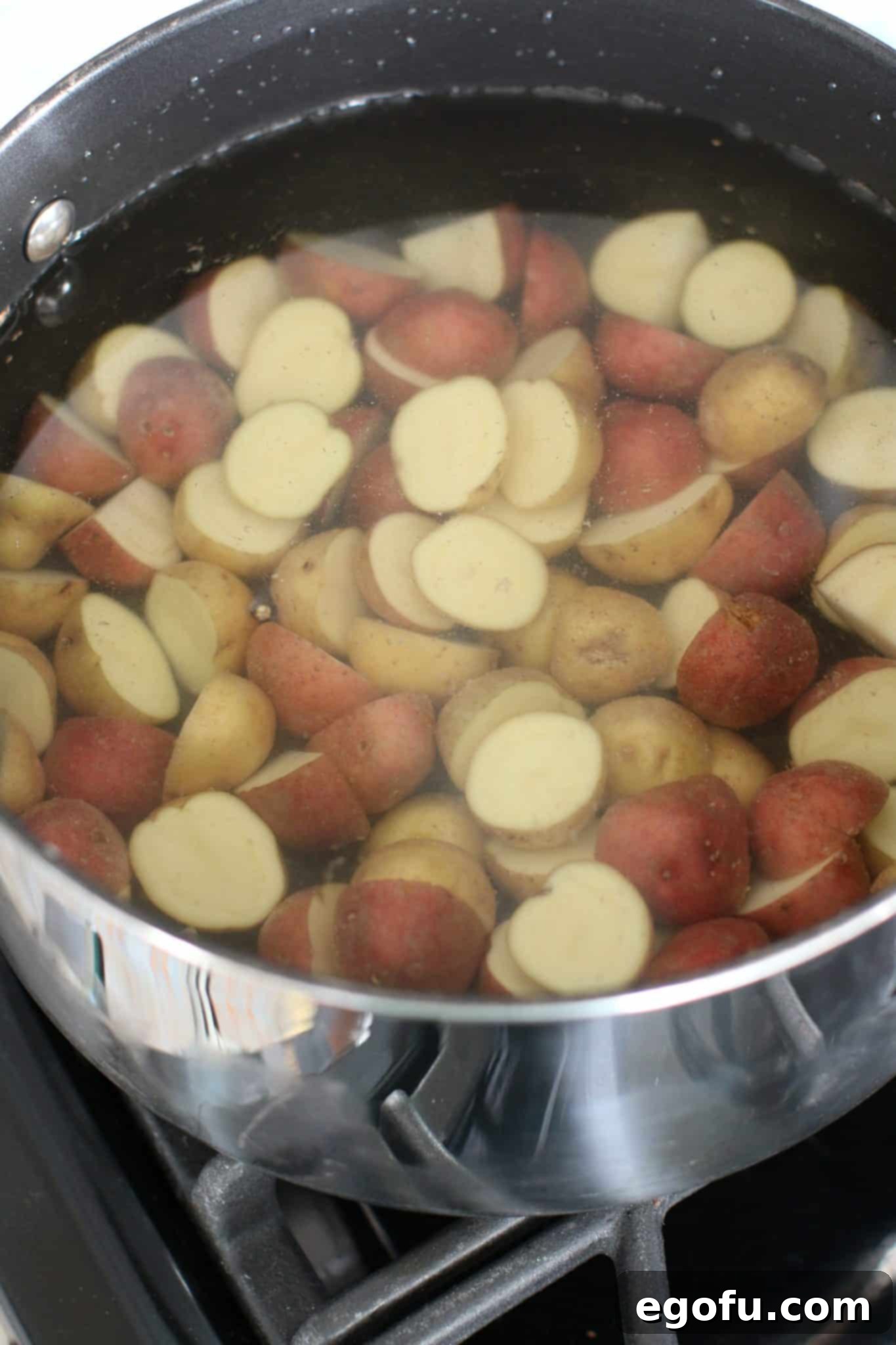 Drained cooked baby potatoes in a colander