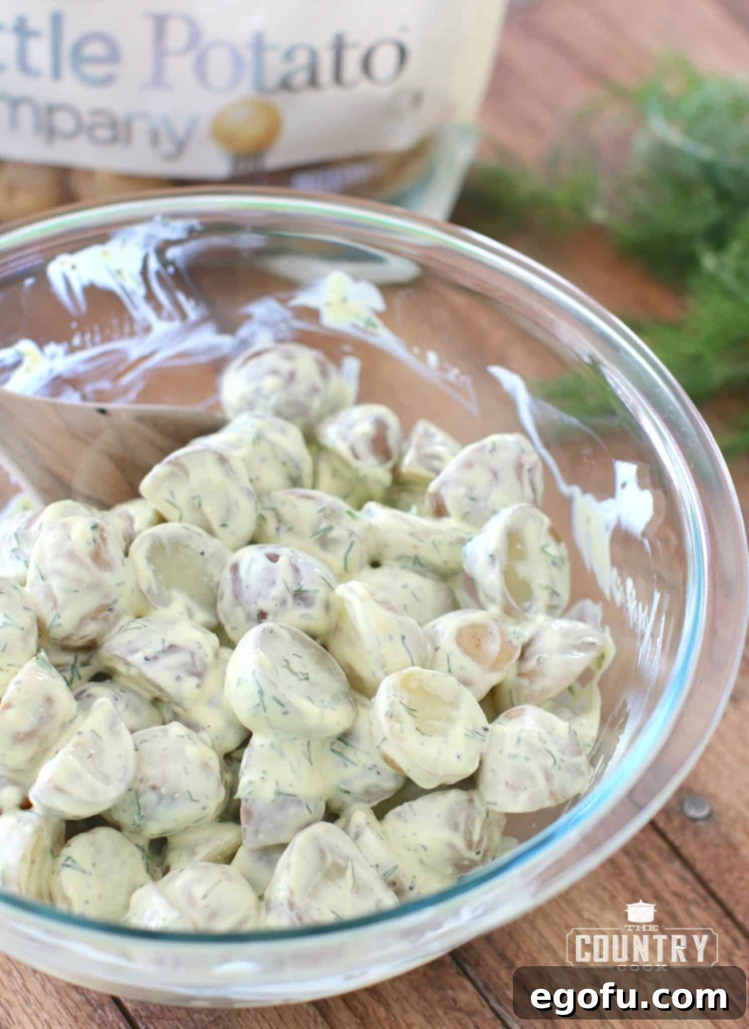 Greek Yogurt Dill Potato Salad chilling in a bowl