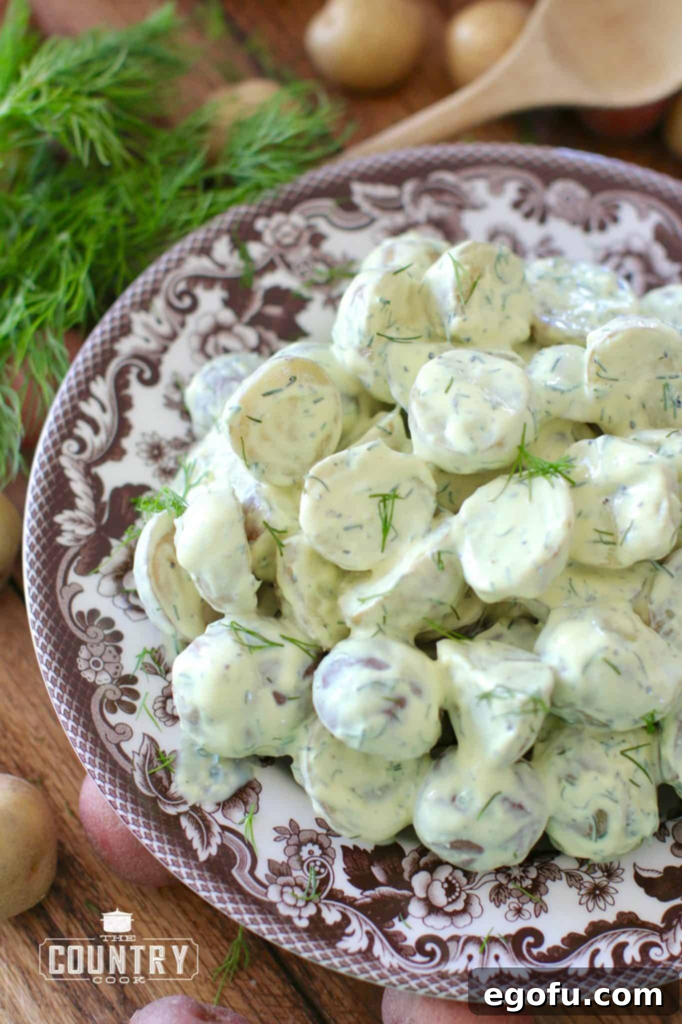 Ready-to-serve Greek Yogurt Dill Potato Salad garnished with fresh dill