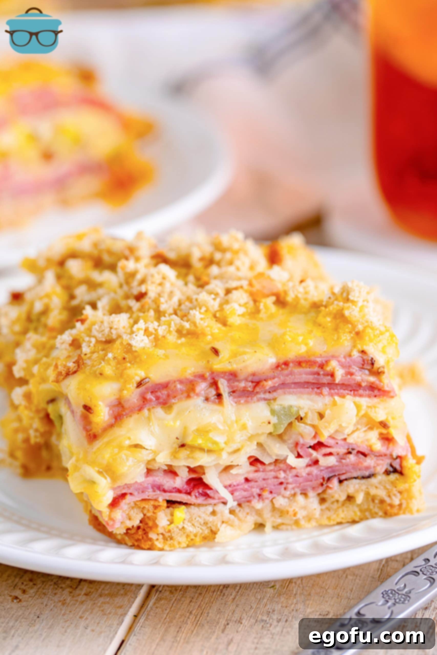 A white dinner plate with a serving of Reuben Casserole.
