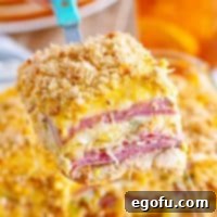 A serving utensil holding a large serving of Reuben Casserole.