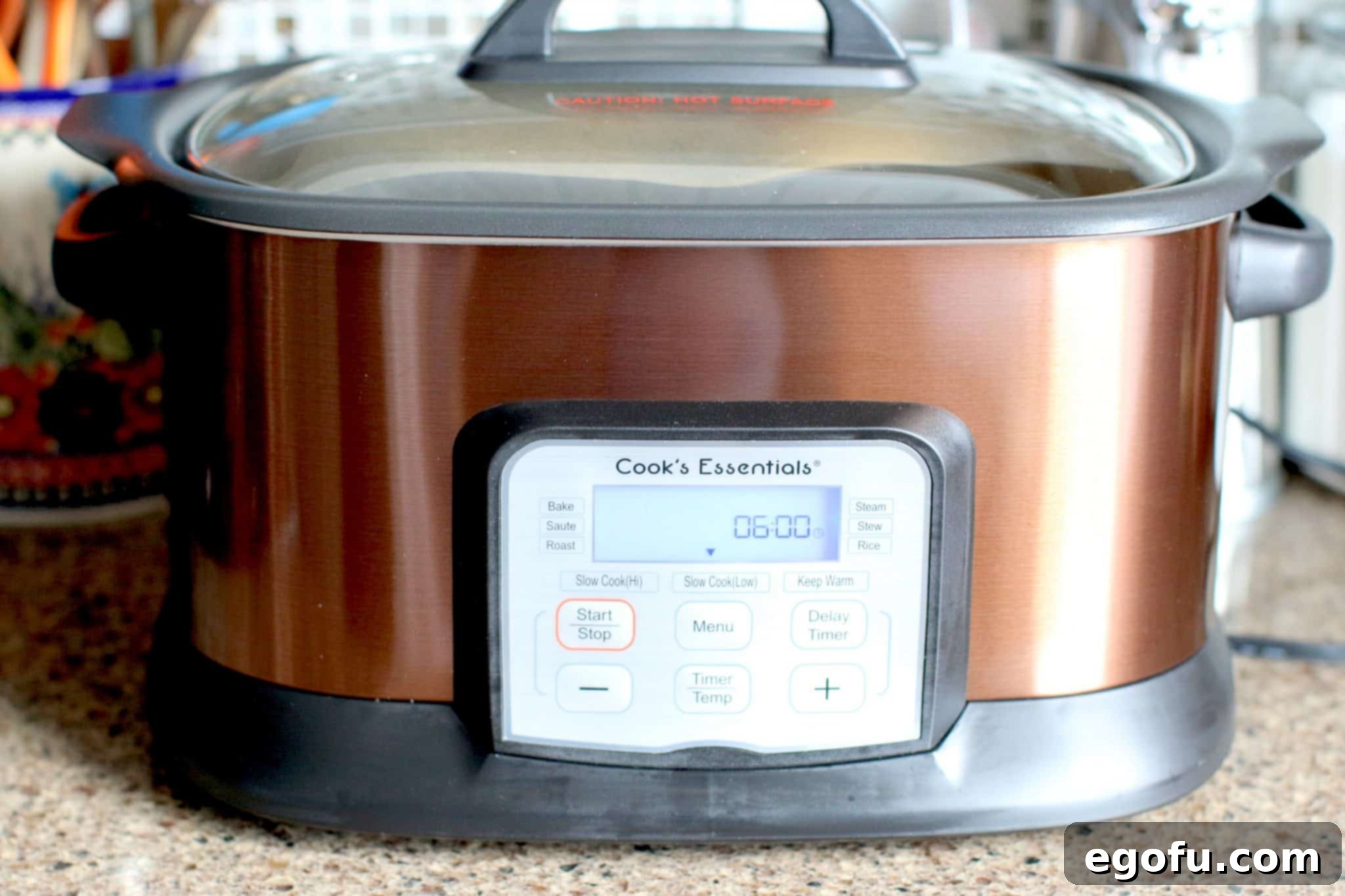 A digital slow cooker with a 4-hour cooking timer displayed
