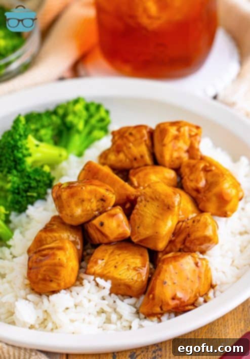 Effortless Teriyaki Glazed Chicken 13 Chicken Teriyaki on rice on a plate with broccoli.