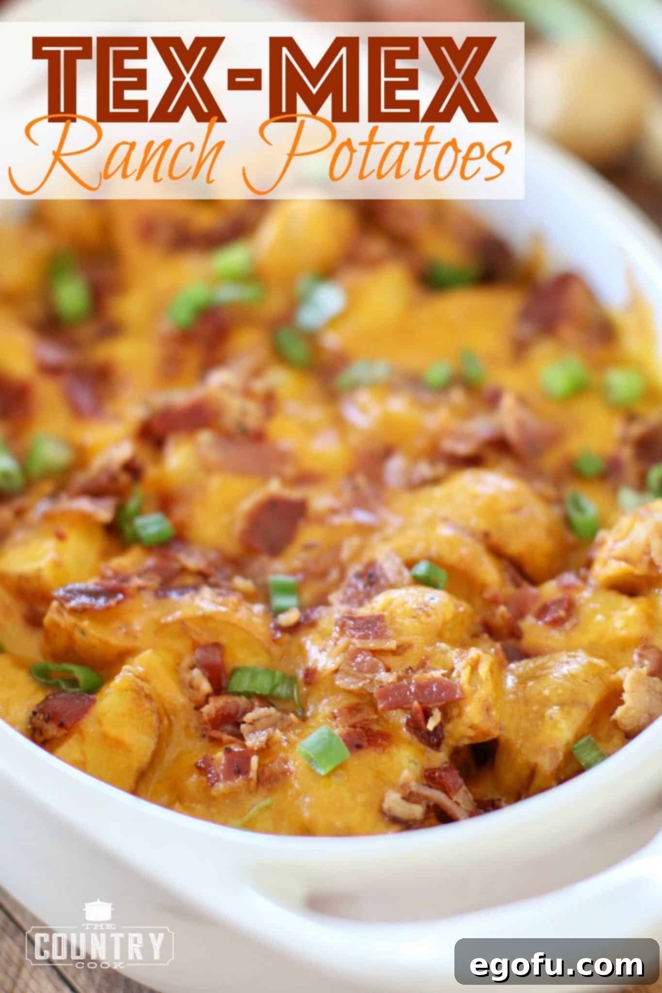 Tex Mex Ranch Potatoes shown closeup in a white oval baking dish with handles.