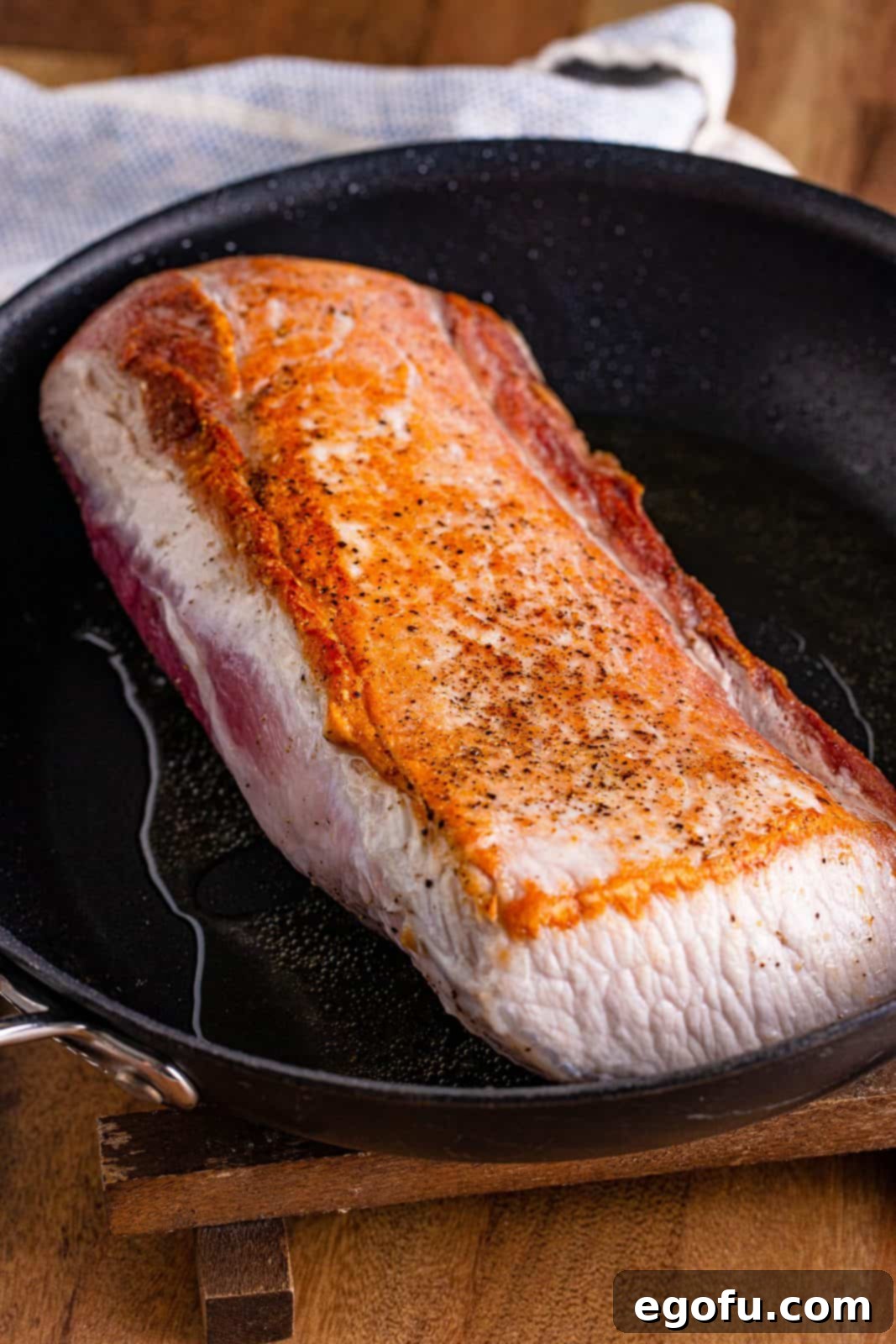 Fall-Apart Mississippi Pork Perfection 7 Pork roast getting seared on both sides until golden brown in a hot skillet.