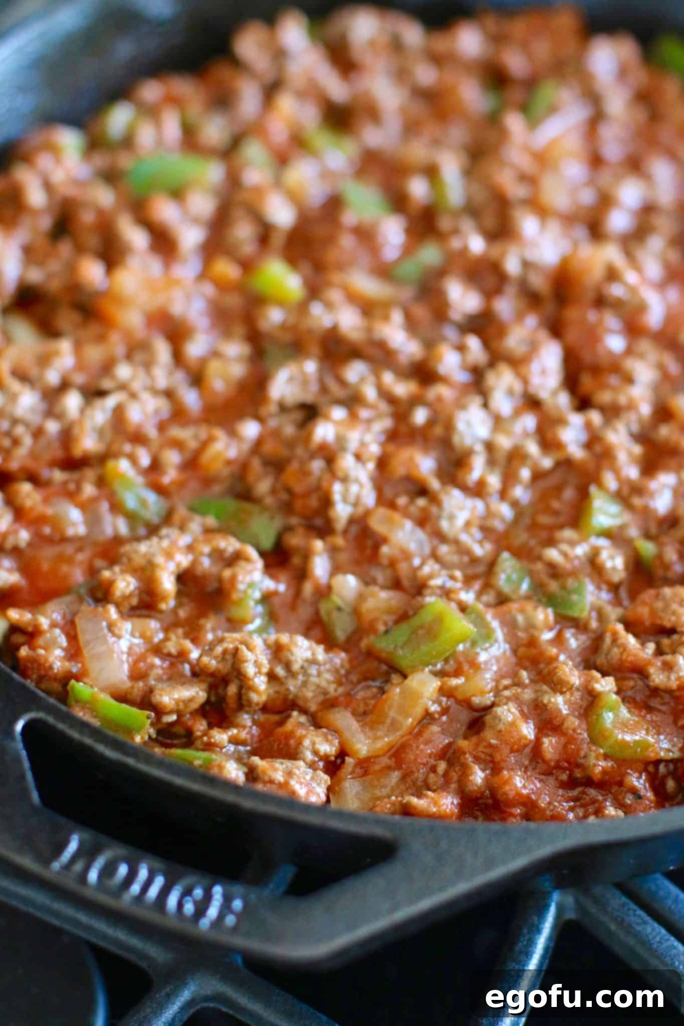 Golden Skillet Cornbread Pizza 10 pizza sauce added to the top of a cornbread crust.