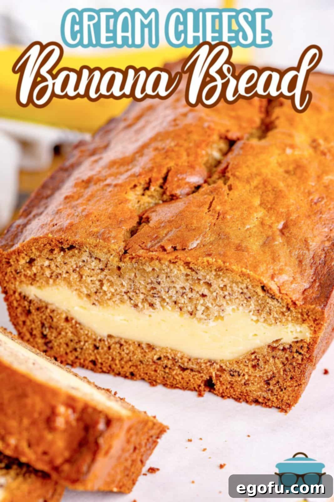 Cream Cheese Swirl Banana Bread 3 Closeup photo showing the incredibly moist interior and distinct cheesecake layer of a cheesecake stuffed banana bread slice.