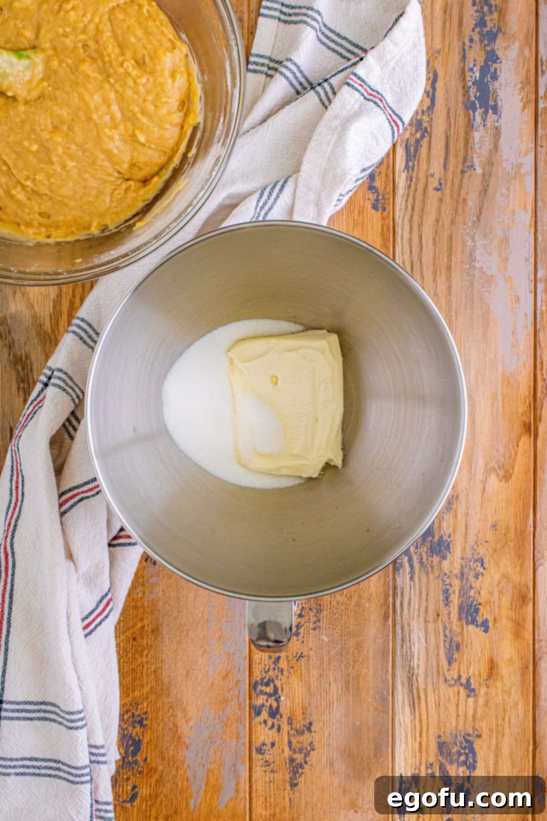 Cream Cheese Swirl Banana Bread 7 Cream cheese and sugar in the bottom of a stand mixer, ready to be beaten until smooth.
