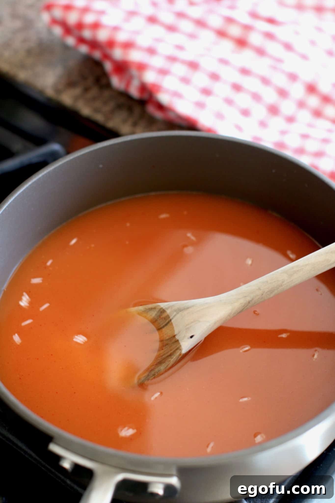 rice, enchilada sauce and chicken broth in a large skillet. 