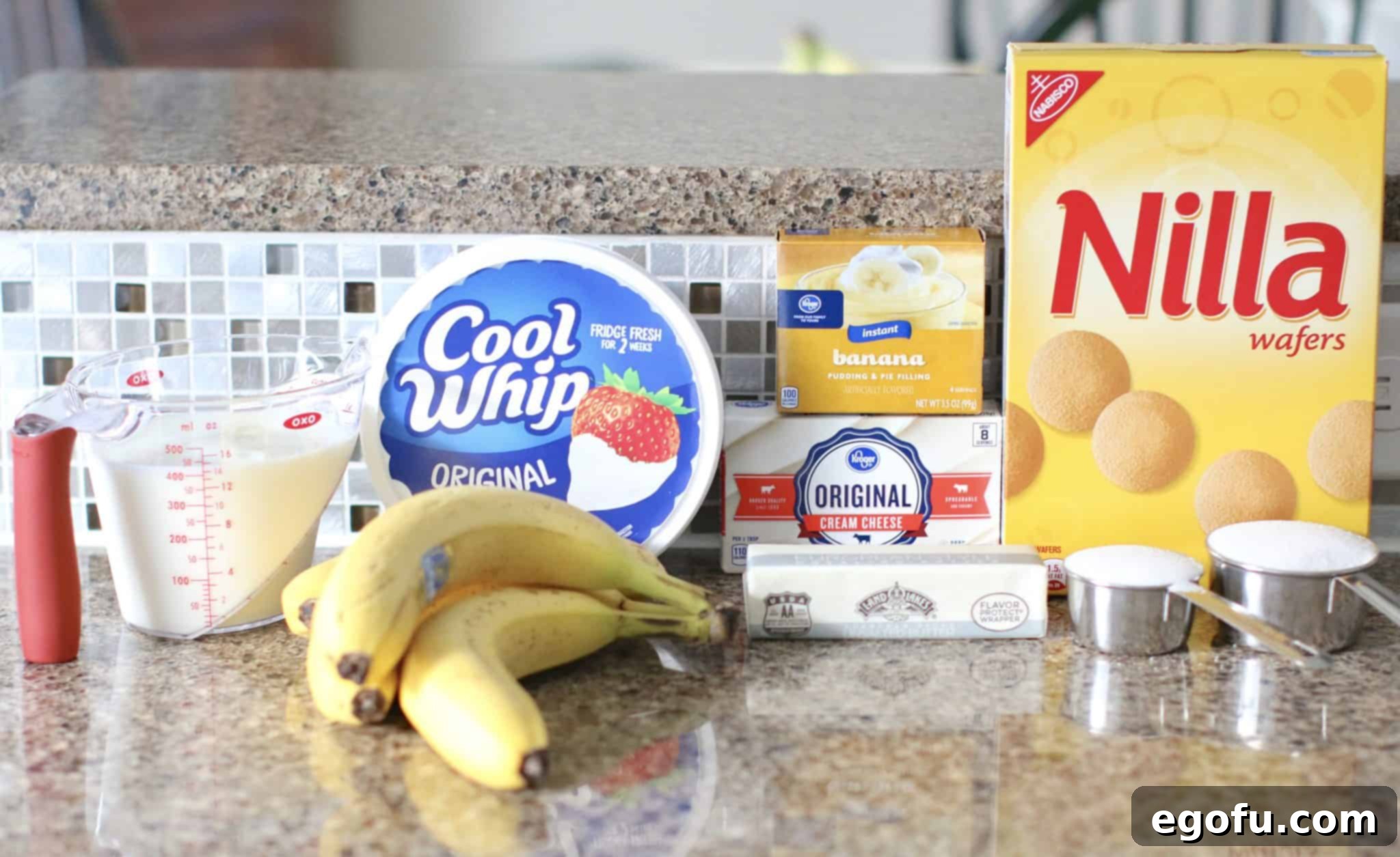 Collage of ingredients for New York Banana Cream Pie: COOL WHIP, Nilla wafers, cream cheese, bananas, butter, sugar, milk, instant banana pudding.