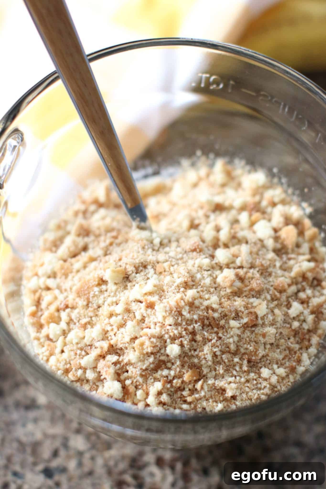 Nilla Wafer crumbs and sugar mixed in a bowl, ready for melted butter.