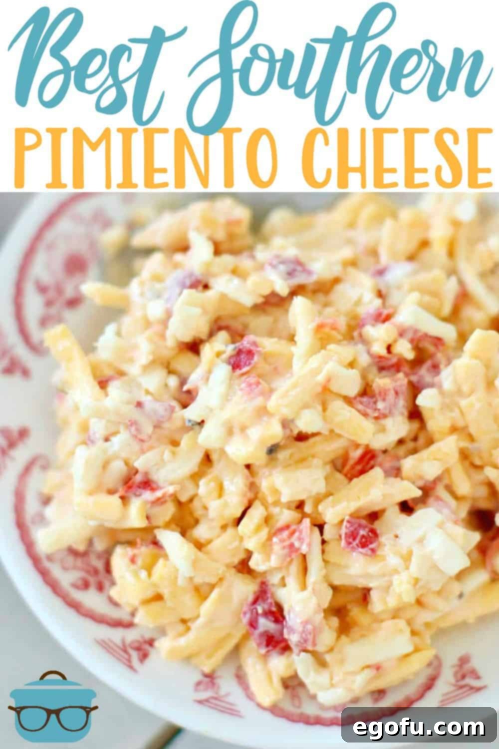 A close-up view of homemade Southern Pimento Cheese on a white and red plate, garnished with fresh herbs, showcasing its creamy texture and rich color, ready to be enjoyed as an appetizer.