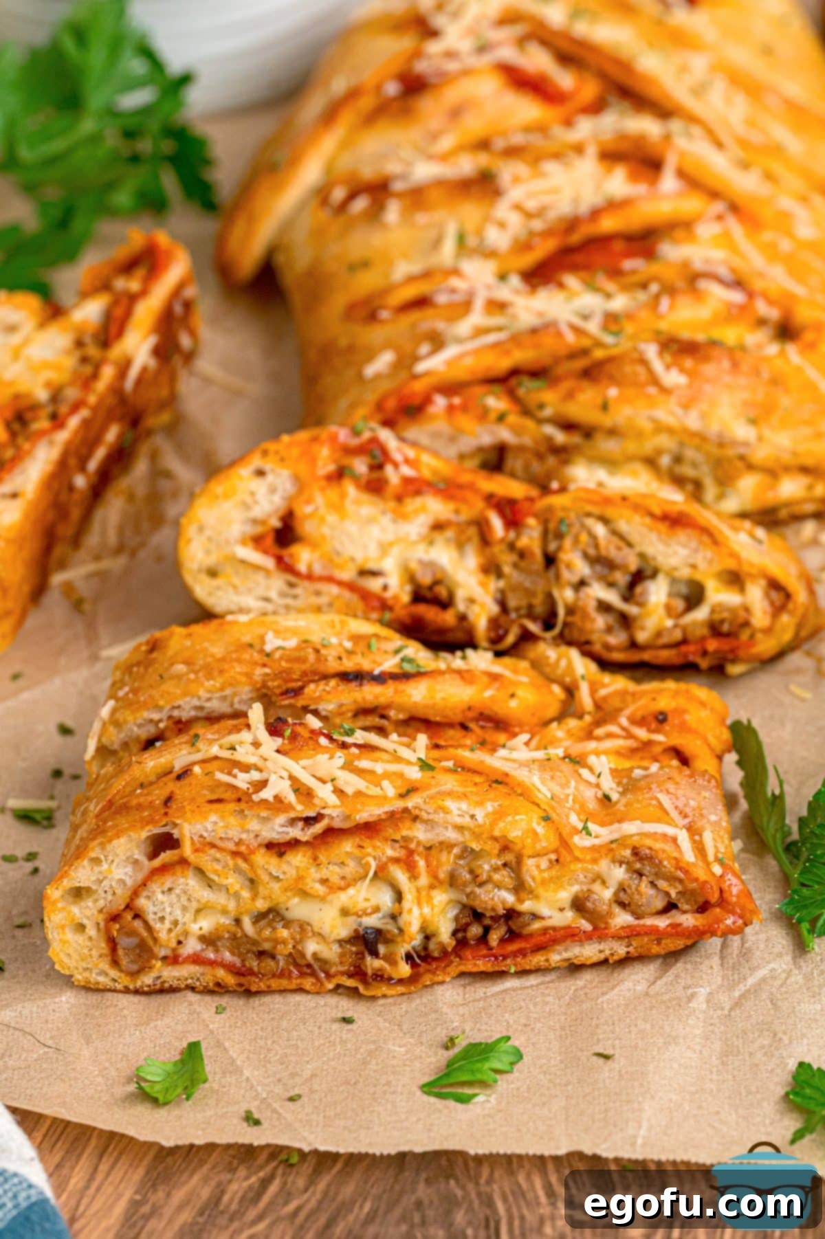 A few slices of Easy Stromboli on parchment paper.