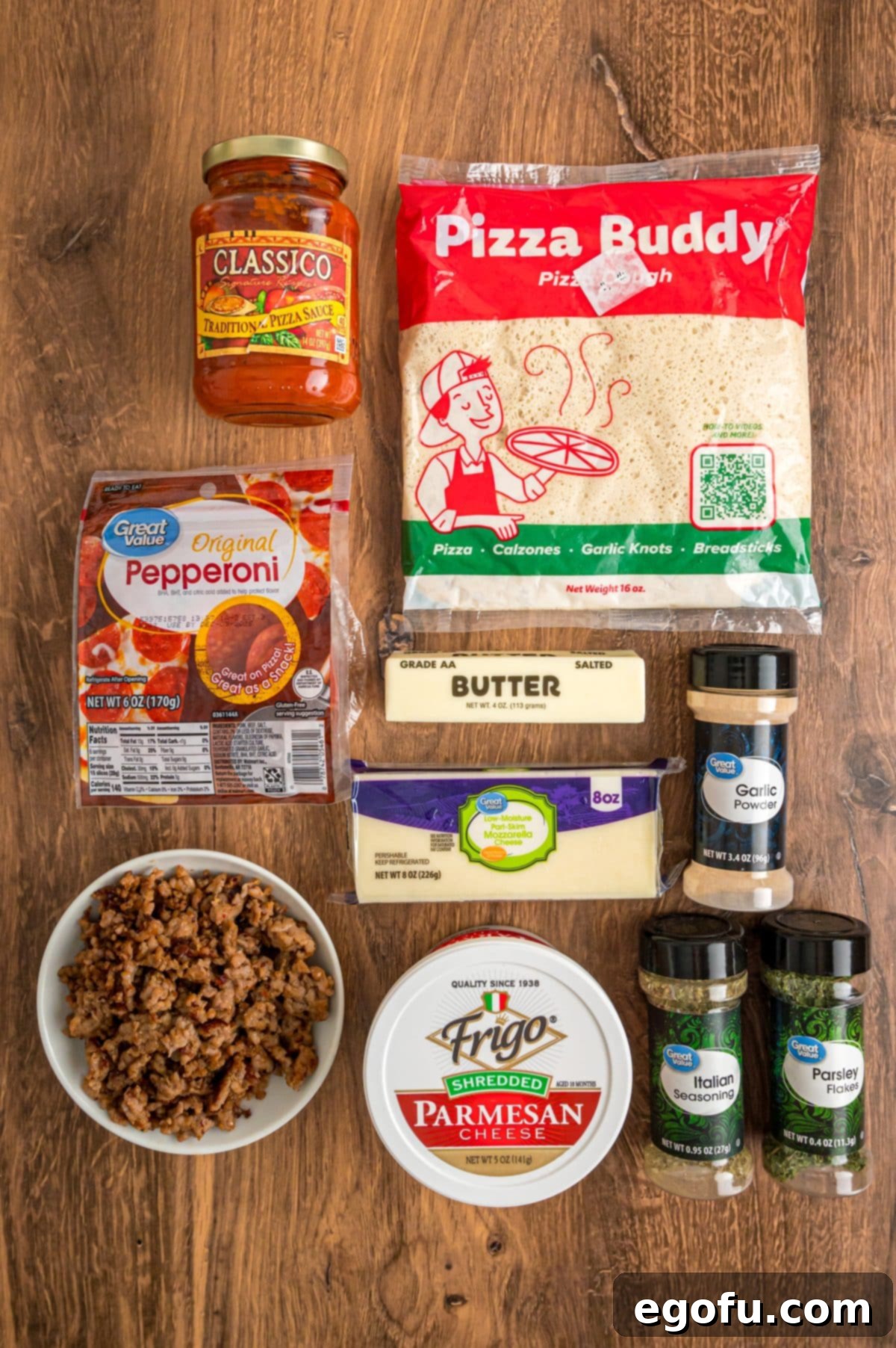 Pizza dough, pizza sauce, pepperoni, crumbled sausage, butter, mozzarella, Italian seasoning, garlic powder, parmesan cheese, and parsley.