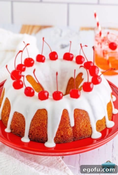A frosted Shirley Temple Poke cake.