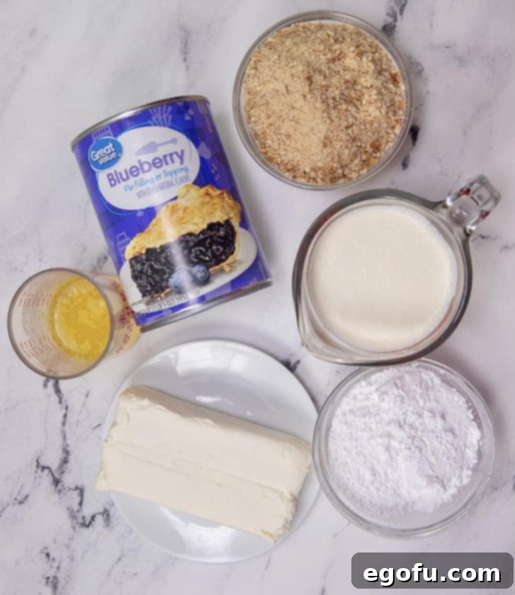 Grandma B's Blueberry Icebox Bars 5 ingredients for blueberry cream cheese bars: vanilla wafers, melted butter, cream cheese, heavy whipping cream, powdered sugar, blueberry pie filling.