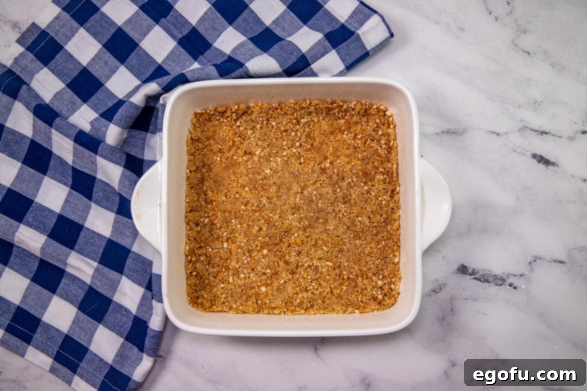 Grandma B's Blueberry Icebox Bars 7 vanilla wafer mixture spread into a square baking dish.