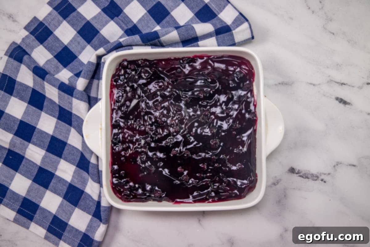 Grandma B's Blueberry Icebox Bars 10 blueberry pie filling bread evenly over creamy cheese filling.