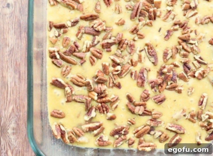 pecan cake batter in a 9X13 baking pan.