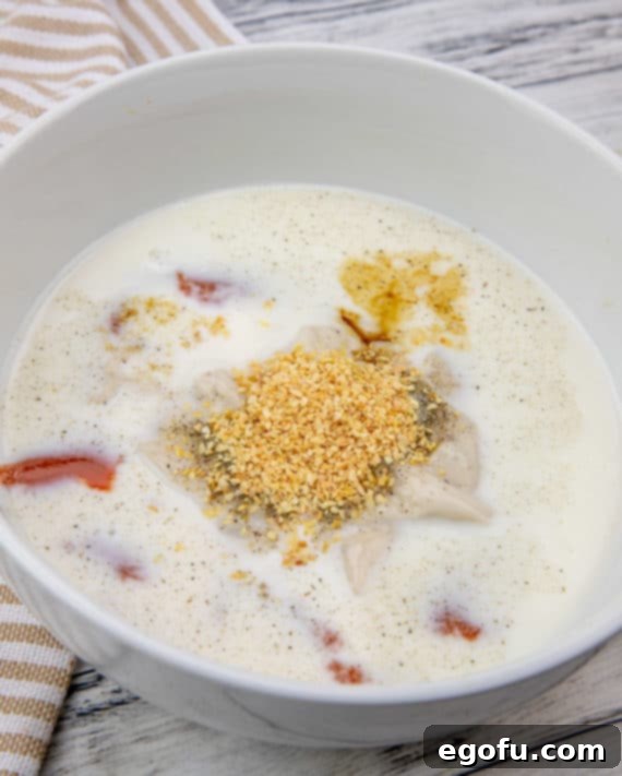 onion flakes and cream of mushroom soup in a bowl.