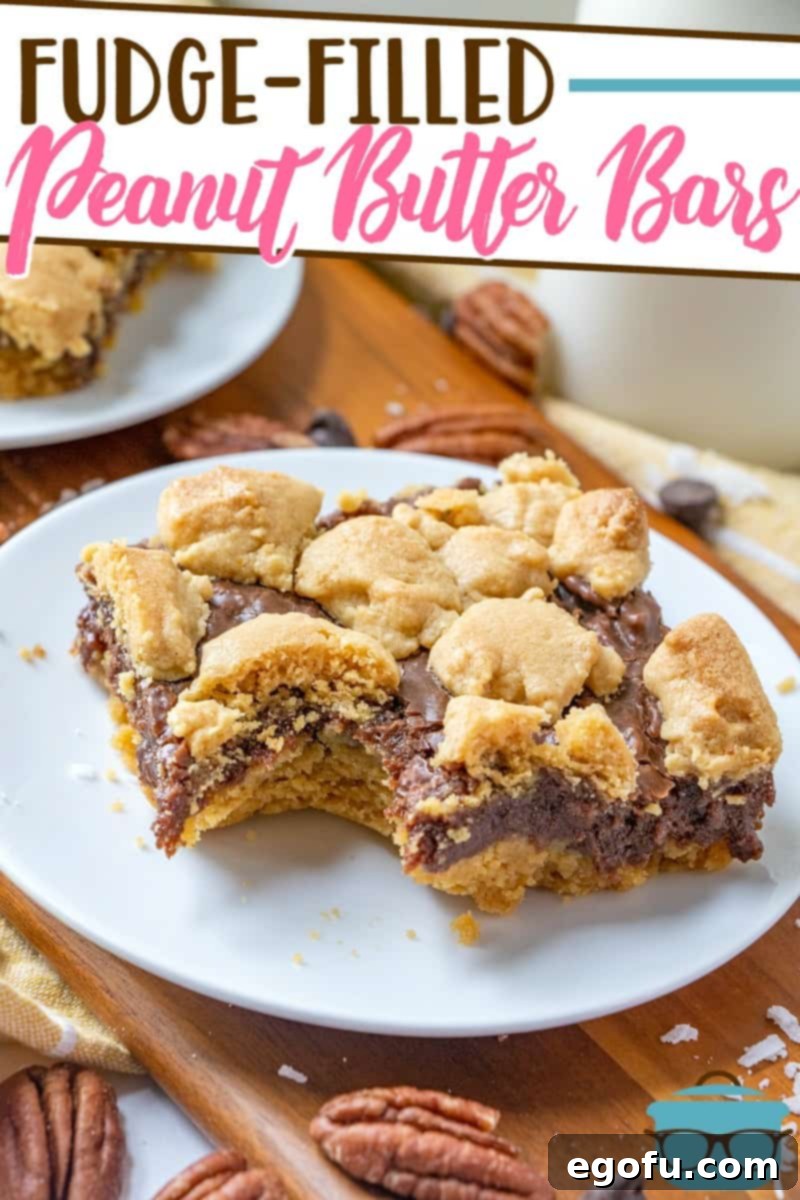 Fudge-Filled Peanut Butter Bars recipe from The Country Cook, slice shown on a white plate with a bite removed.