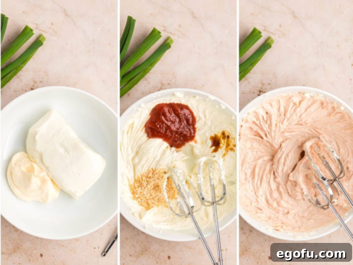 A bowl containing smooth, beaten cream cheese and mayonnaise, forming the creamy base for the Shrimp Dip.