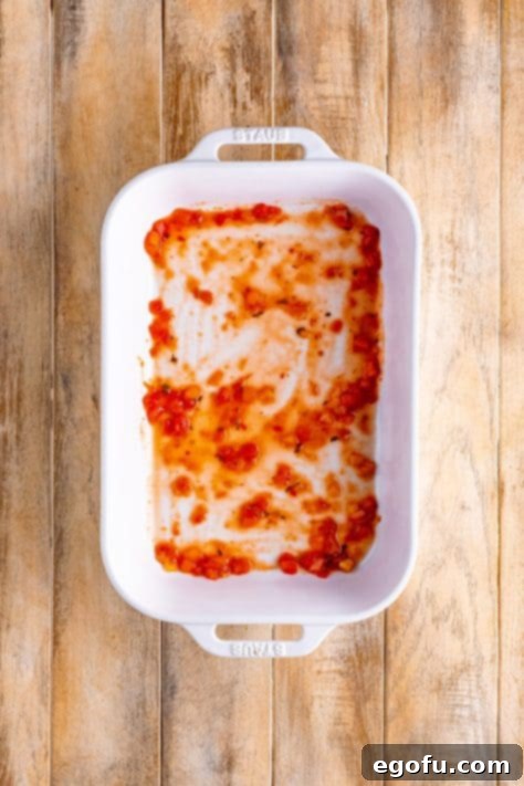 salsa spread into the bottom of a baking dish.