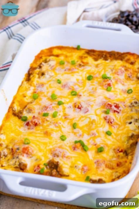 fully baked Mexican Lasagna in a white baking dish.