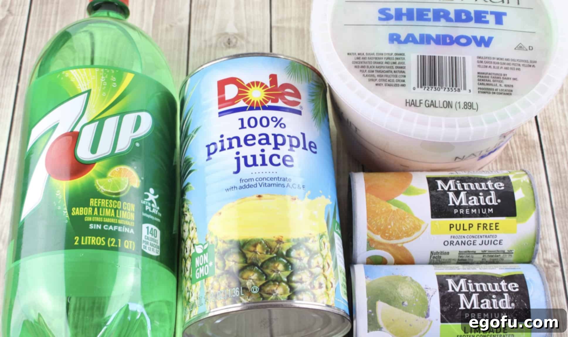 Collection of ingredients including 7-UP, pineapple juice, frozen limeade, frozen orange juice, and rainbow sherbet for Presbyterian Punch.