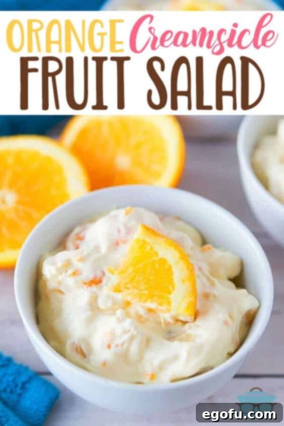 Close-up of Orange Creamsicle Fruit Salad, showing its vibrant color and smooth texture.