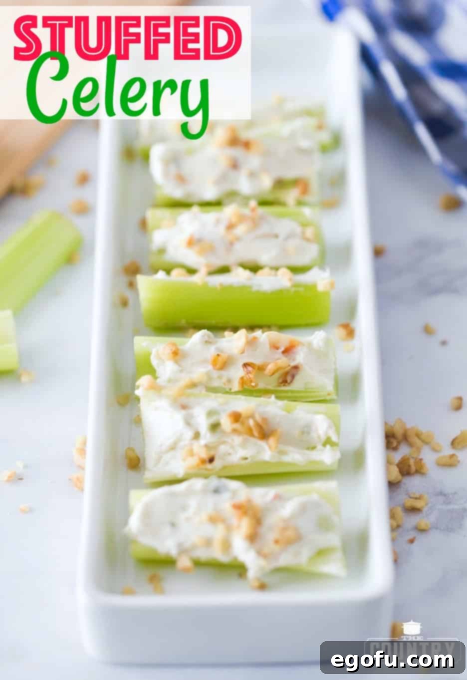 Stuffed Celery recipe displayed on a white platter. Crispy celery filled with creamy cheese mixture, ready to serve.