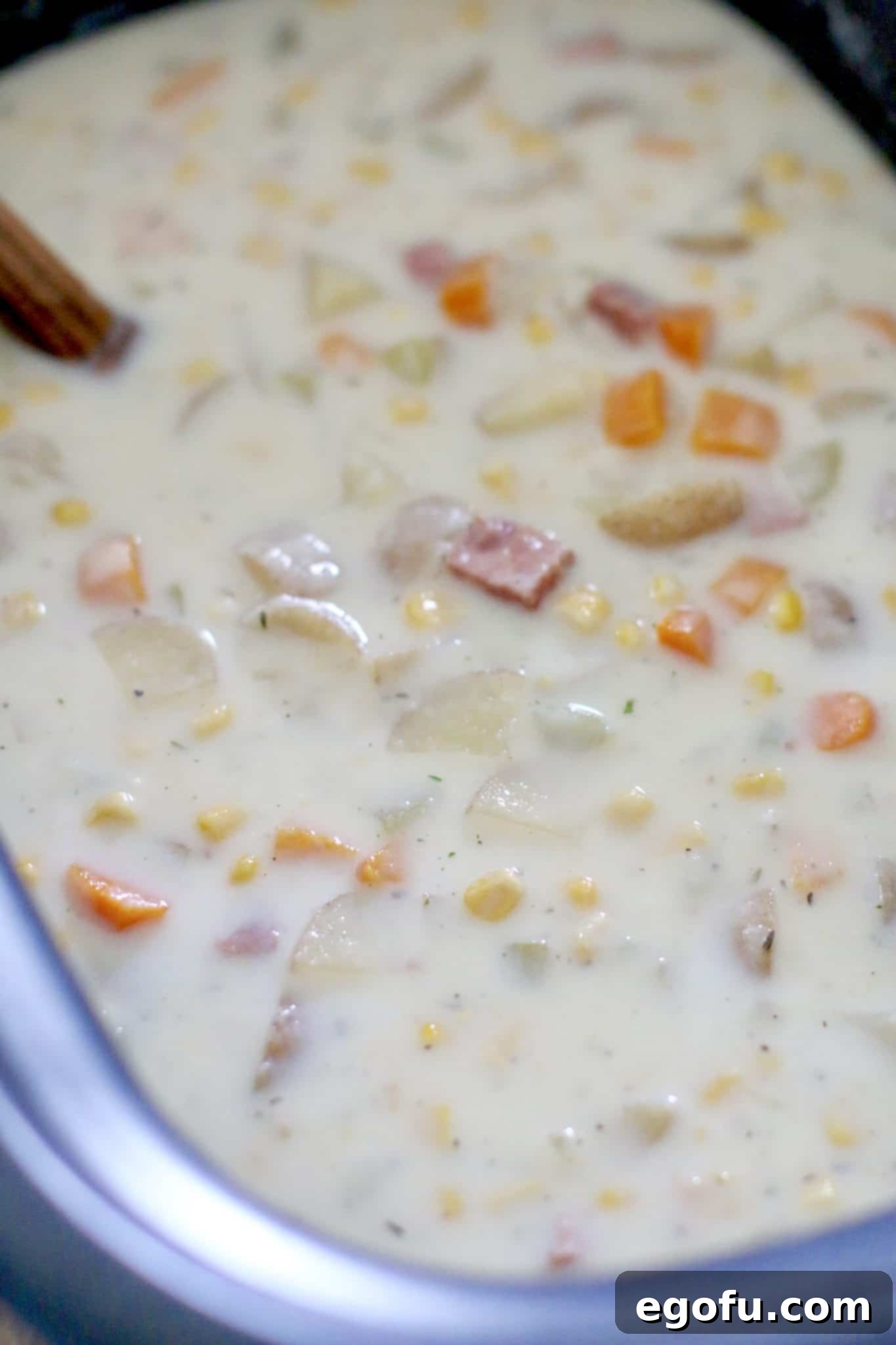 slow cooker ham, potato and corn chowder fully cooked in a crock pot.