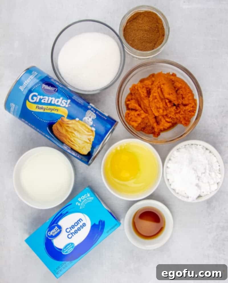 Ingredients needed for Pumpkin Pull-Apart Bread: pure pumpkin puree, sugar, vanilla extract, pumpkin pie spice, Pillsbury Grands Flaky Layers Biscuits, cream cheese, powdered sugar, milk