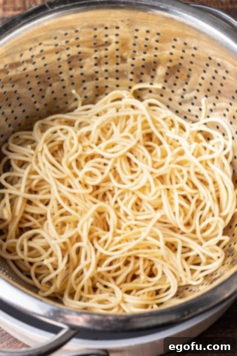 Cooked spaghetti in a pot.