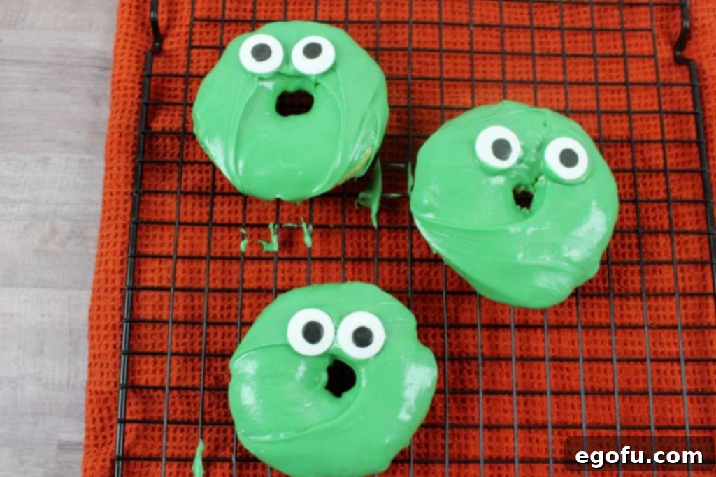 Frankenstein Doughnuts with candy eyes already placed, adding character.